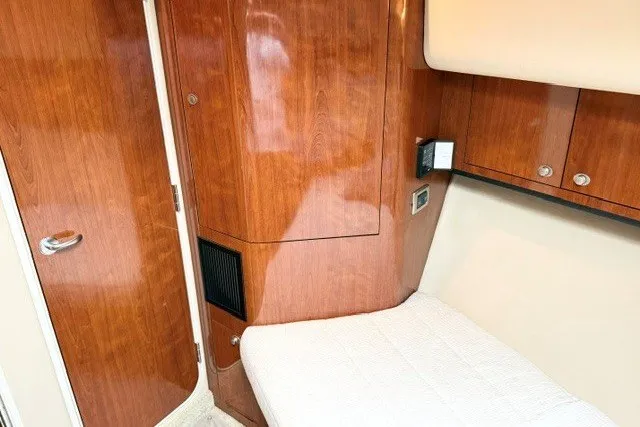 Slide: The Image of Interior cabin of 2004 Sea Ray 390 Motor Yacht with wood paneling and bed. - 32