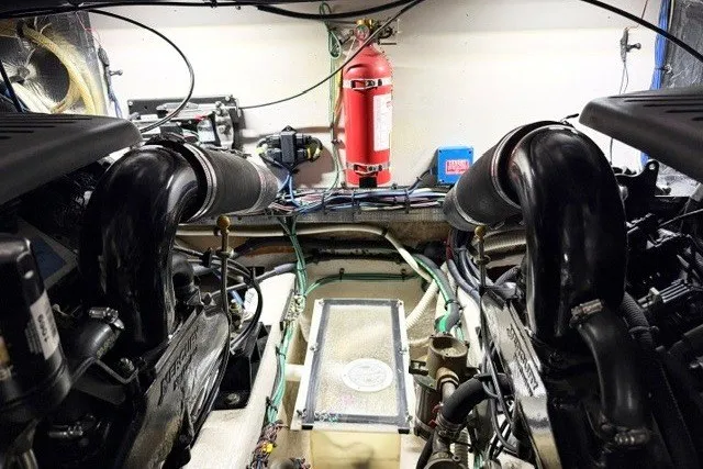 Slide: The Image of Engine room of a 2004 Sea Ray 390 Motor Yacht with visible fire extinguisher. - 53