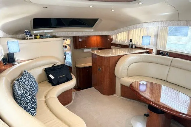 Slide: The Image of Luxurious interior of a 2004 Sea Ray 390 Motor Yacht with elegant seating and wood finishes. - 8