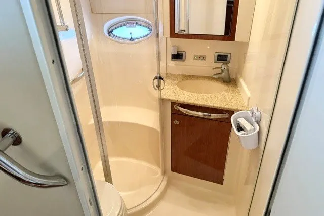 Slide: The Image of Luxurious bathroom in 2004 Sea Ray 390 Motor Yacht with modern fixtures and elegant design. - 26