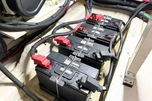 Slide: The Image of Batteries in the engine room of a 2004 Sea Ray 390 Motor Yacht. - 54