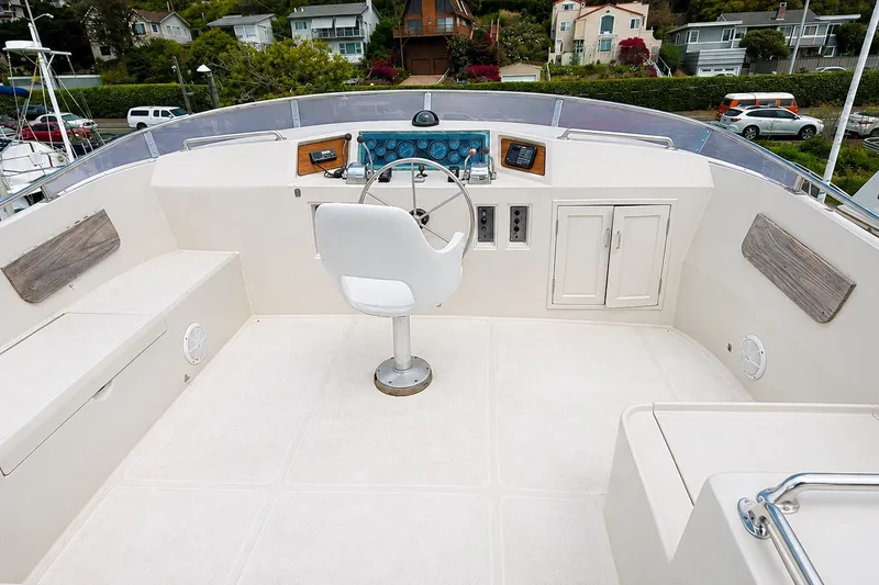 Slide: The Image of Cockpit of 1988 Angel 45 AFT CABIN MV yacht with steering wheel and control panel. - 5