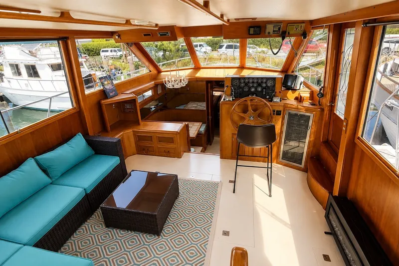 Slide: The Image of Luxurious interior of 1988 Angel 45 AFT CABIN MV yacht with elegant wood finish and modern seating. - 11