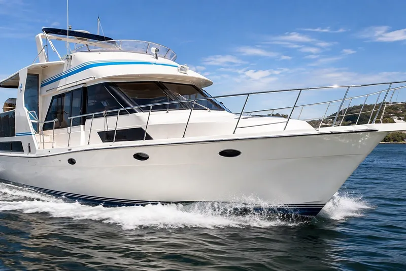 The Image of 1988 Angel 45 AFT CABIN MV yacht cruising on open water under clear skies. - 0