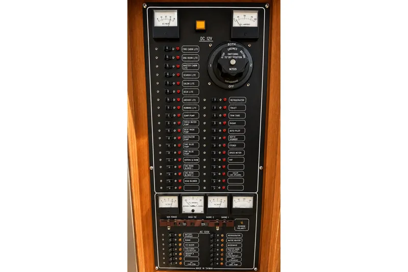 Slide: The Image of Electrical control panel of 1988 Angel 45 AFT CABIN MV boat, featuring gauges and switches. - 26