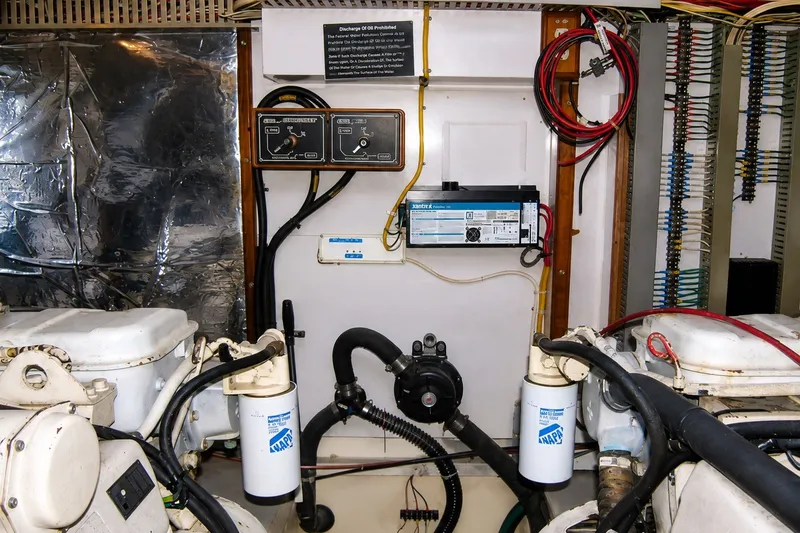 Slide: The Image of Engine room of 1988 Angel 45 AFT CABIN MV with filters and control panels. - 27