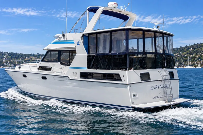 Slide: The Image of 1988 Angel 45 AFT CABIN MV yacht cruising on a sunny day. - 1