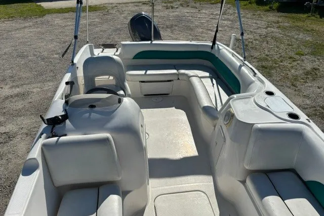 Slide: The Image of 2012 Hurricane SunDeck Sport 188 OB boat interior with seating and steering console. - 7
