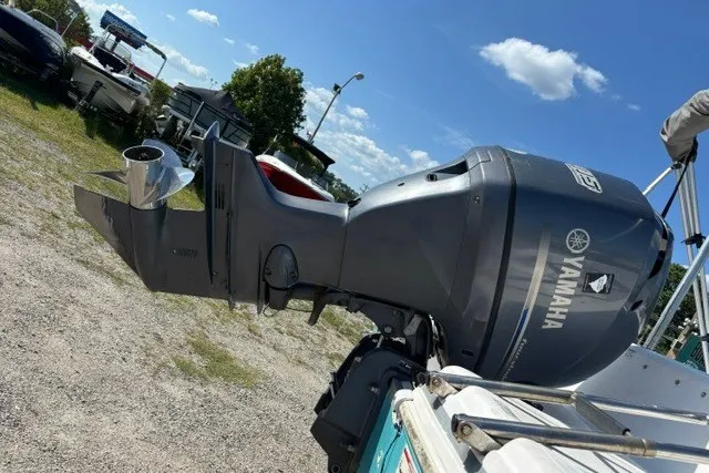 Slide: The Image of 2012 Hurricane SunDeck Sport 188 OB with Yamaha outboard motor in a sunny outdoor setting. - 10