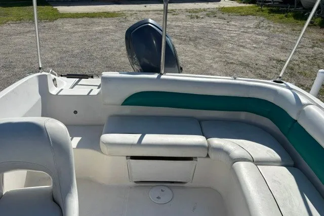 Slide: The Image of 2012 Hurricane SunDeck Sport 188 OB boat interior with white and teal seating. - 6