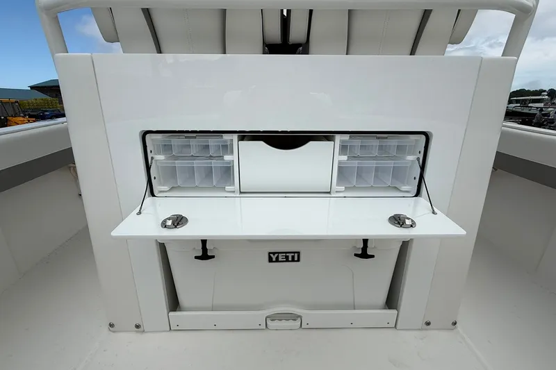 Slide: The Image of 2026 Regulator 28 boat with integrated Yeti cooler and storage compartments. - 17
