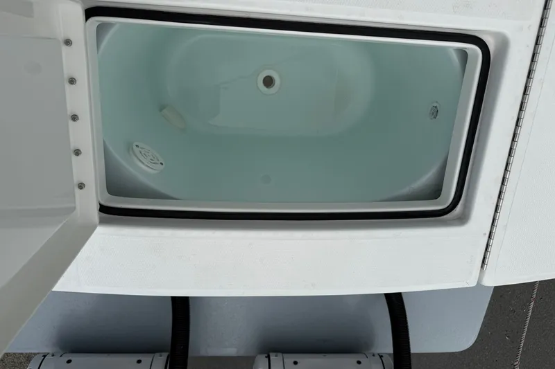 Slide: The Image of Open storage compartment on 2026 Regulator 28 boat, showcasing interior design. - 24