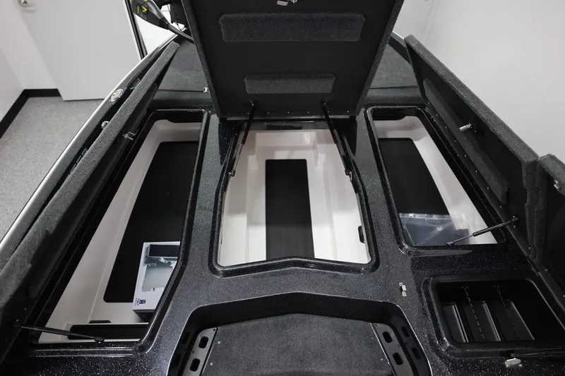 Slide: The Image of 2026 Skeeter ZXR19 SE boat interior storage compartments open for viewing. - 16