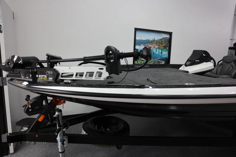 Slide: The Image of 2026 Skeeter ZXR19 SE boat with Minn Kota Fortrex trolling motor in showroom. - 13