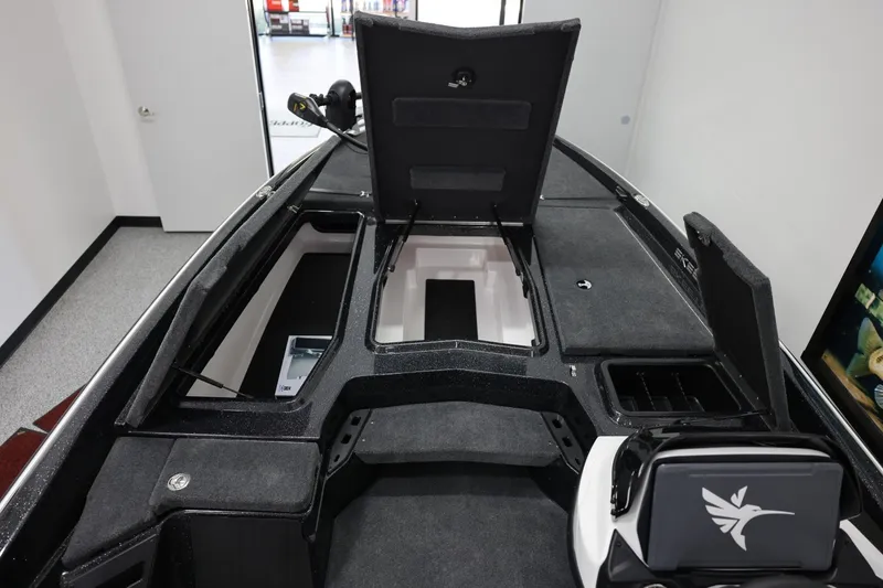 Slide: The Image of 2026 Skeeter ZXR19 SE boat interior with open storage compartments and sleek design. - 15