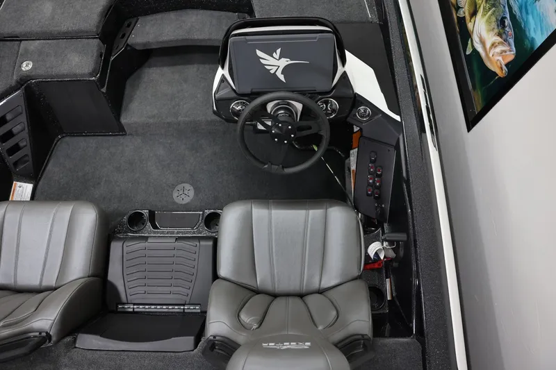 Slide: The Image of 2026 Skeeter ZXR19 SE boat interior with steering wheel and dual seats. - 10