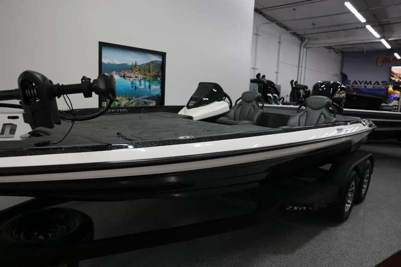 Slide: The Image of 2026 Skeeter ZXR19 SE boat displayed in a showroom, featuring sleek design and modern seating. - 7