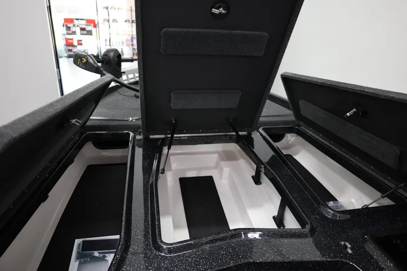 Slide: The Image of 2026 Skeeter ZXR19 SE boat storage compartments open, showcasing spacious interior design. - 17