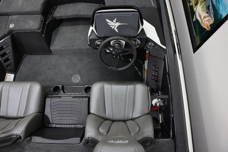 Slide: The Image of 2026 Skeeter ZXR19 SE boat interior with dual seats, steering wheel, and control panel. - 5