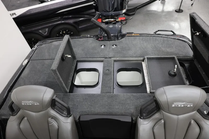 Slide: The Image of 2026 Skeeter ZXR19 SE boat interior with storage compartments and seating. - 19