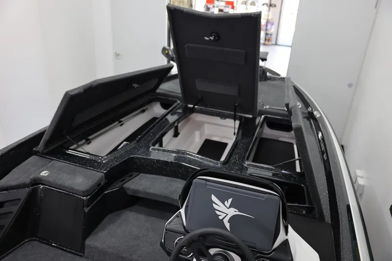 Slide: The Image of 2026 Skeeter ZXR19 SE boat interior with open storage compartments. - 18