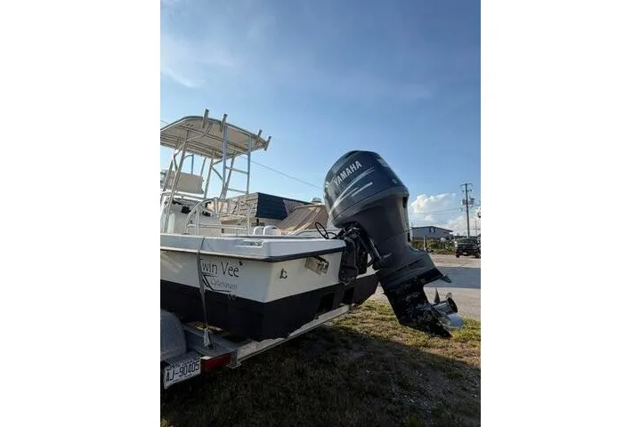 Slide: The Image of 2009 Twin Vee 22 BayCat boat with Yamaha outboard motor on trailer. - 4