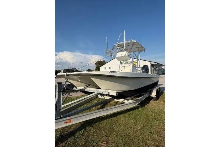 Slide: The Image of 2009 Twin Vee 22 BayCat boat on trailer under clear blue sky. - 7