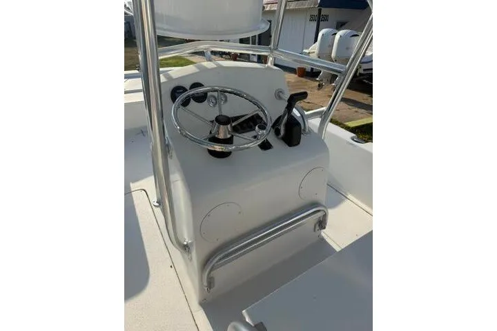 Slide: The Image of 2009 Twin Vee 22 BayCat boat console with steering wheel and controls. - 24