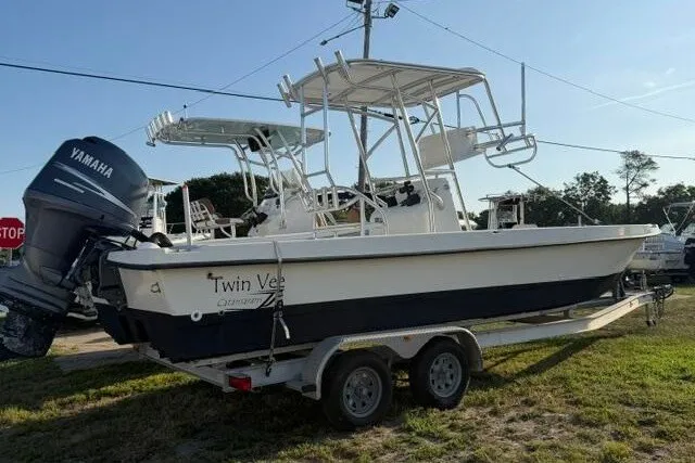 Slide: The Image of 2009 Twin Vee 22 BayCat boat on trailer with Yamaha outboard motor. - 2