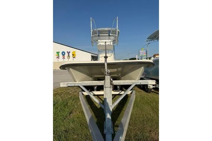 Slide: The Image of 2009 Twin Vee 22 BayCat boat on trailer, parked outdoors under clear sky. - 8