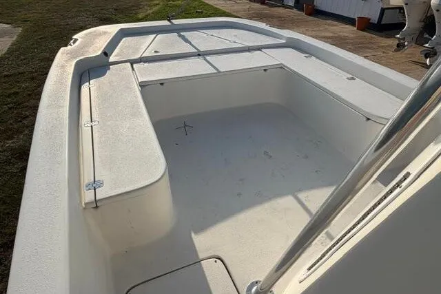 Slide: The Image of 2009 Twin Vee 22 BayCat boat interior, showcasing spacious seating and storage areas. - 10