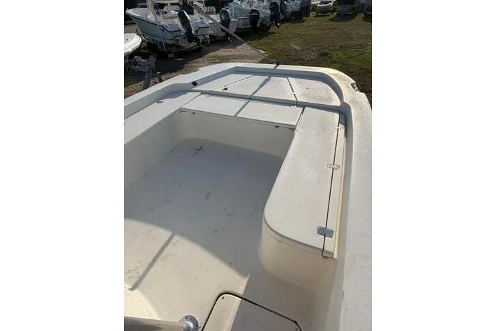 Slide: The Image of 2009 Twin Vee 22 BayCat boat interior with spacious seating and storage. - 13