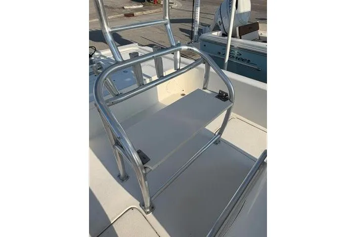 Slide: The Image of 2009 Twin Vee 22 BayCat boat with sturdy metal railing and seating area. - 18