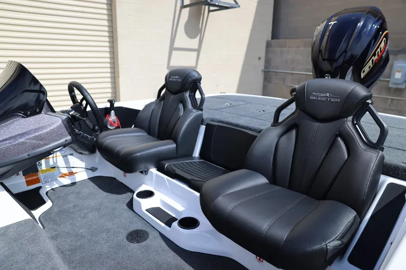 Slide: The Image of 2026 Skeeter ZXR20 SE boat interior with black leather seats and modern dashboard. - 7