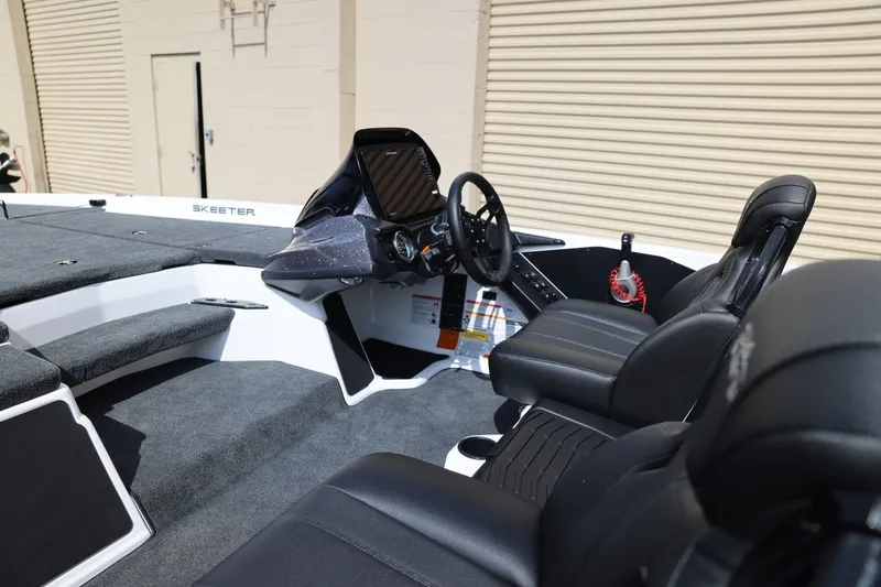 Slide: The Image of 2026 Skeeter ZXR20 SE boat interior with steering wheel and seating. - 8