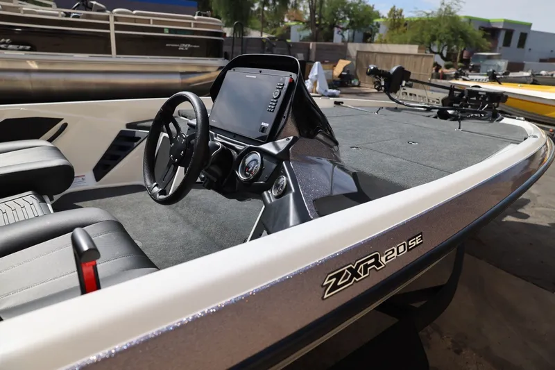Slide: The Image of 2026 Skeeter ZXR20 SE boat interior with steering wheel and dashboard display. - 3