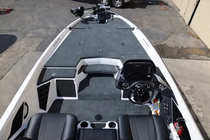 Slide: The Image of 2026 Skeeter ZXR20 SE boat interior with modern dashboard and seating. - 11
