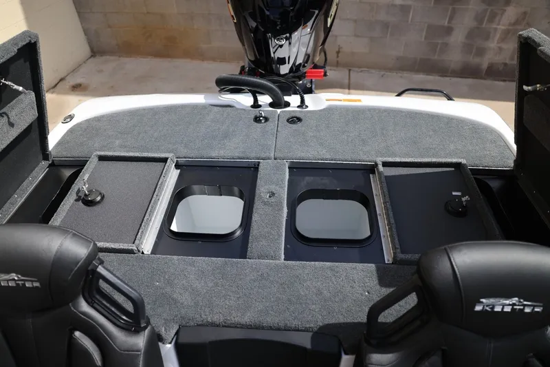 Slide: The Image of 2026 Skeeter ZXR20 SE boat interior with storage compartments and seating. - 14