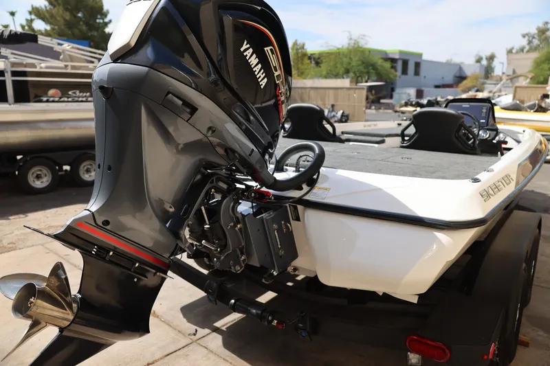 Slide: The Image of 2026 Skeeter ZXR20 SE boat with Yamaha outboard motor, parked on a trailer. - 4