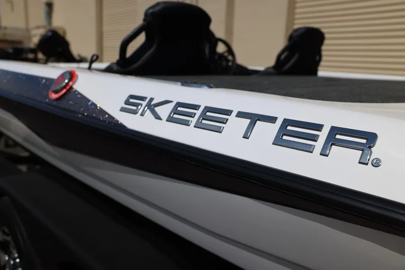 Slide: The Image of 2026 Skeeter ZXR20 SE boat with sleek design and logo detail. - 6