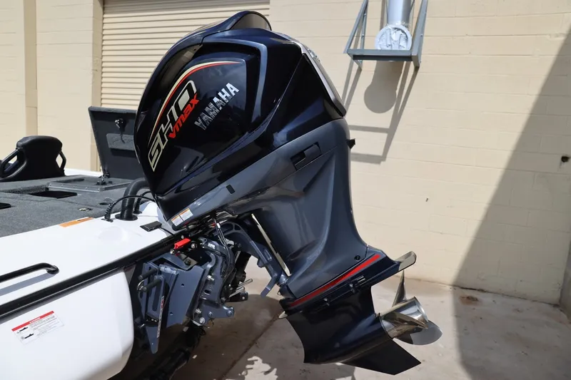 Slide: The Image of 2026 Skeeter ZXR20 SE with Yamaha VMAX outboard motor, parked outdoors. - 18