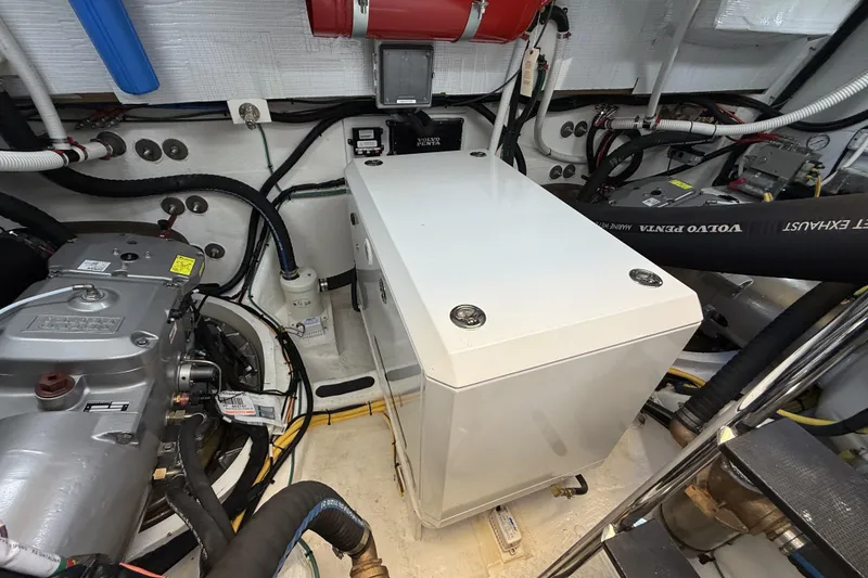 Slide: The Image of Engine room of 2022 Sabre 48 Salon Express with Volvo Penta components and wiring. - 57