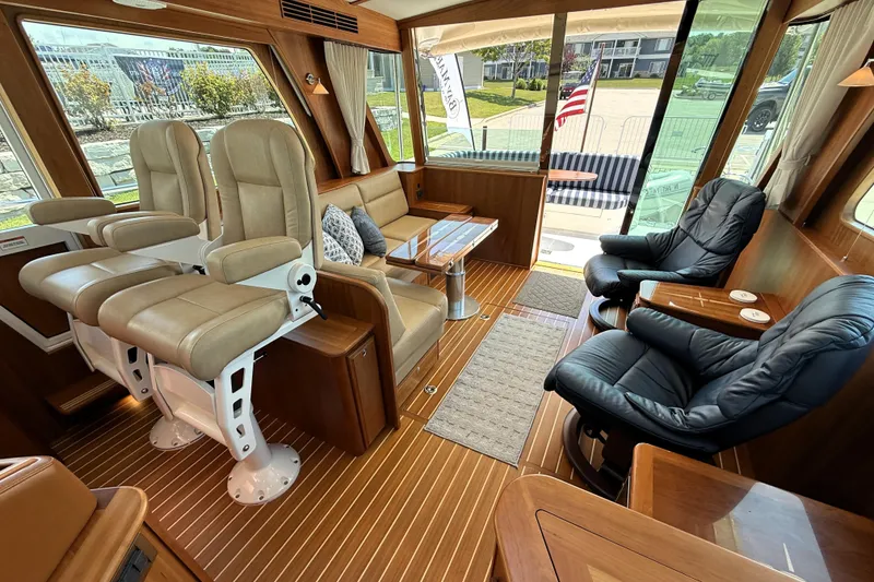 Slide: The Image of Luxurious interior of 2022 Sabre 48 Salon Express yacht with plush seating and elegant wood finishes. - 21