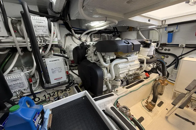 Slide: The Image of Engine room of 2022 Sabre 48 Salon Express yacht, showcasing machinery and components. - 55