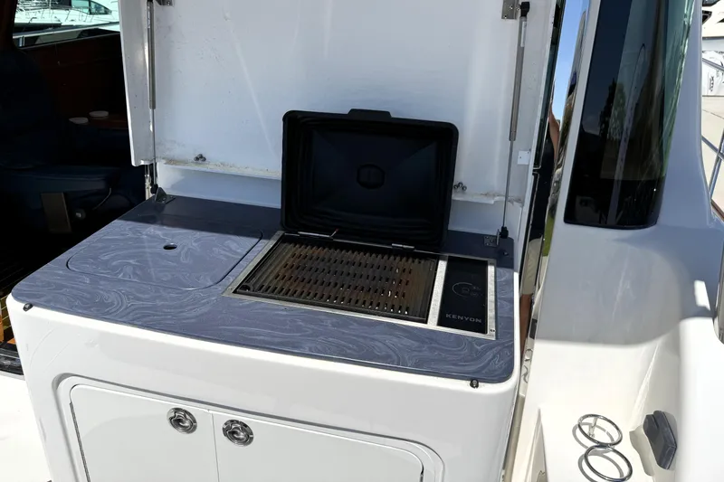 Slide: The Image of Outdoor grill on 2022 Sabre 48 Salon Express yacht deck. - 10