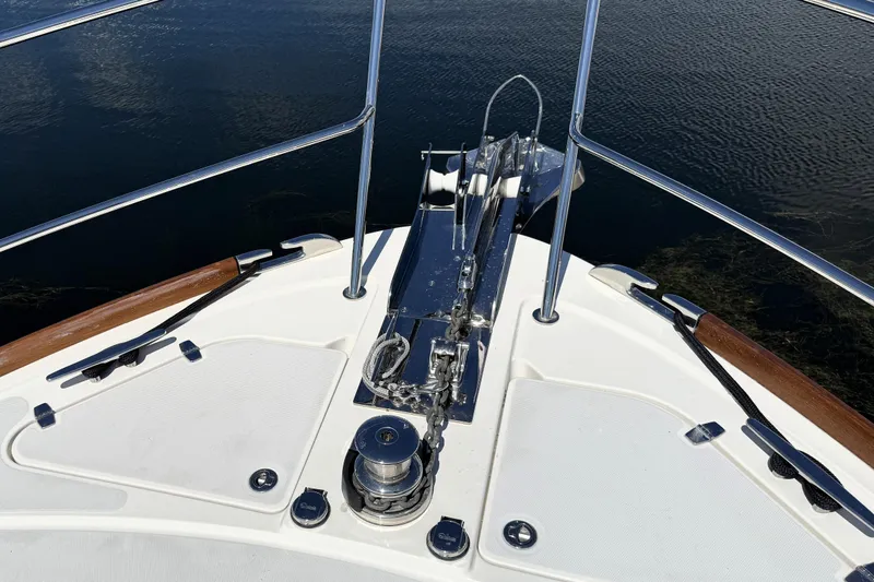 Slide: The Image of Bow of 2022 Sabre 48 Salon Express yacht with anchor and railing details. - 46
