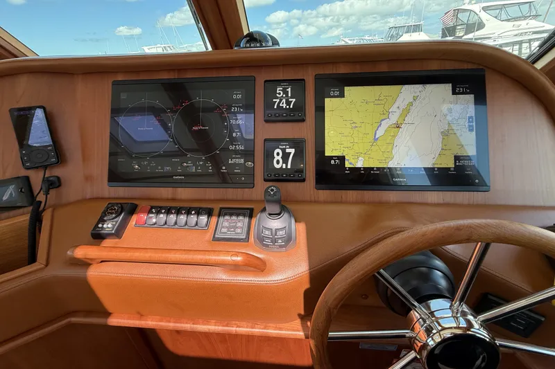 Slide: The Image of Dashboard of 2022 Sabre 48 Salon Express with navigation screens and controls. - 24