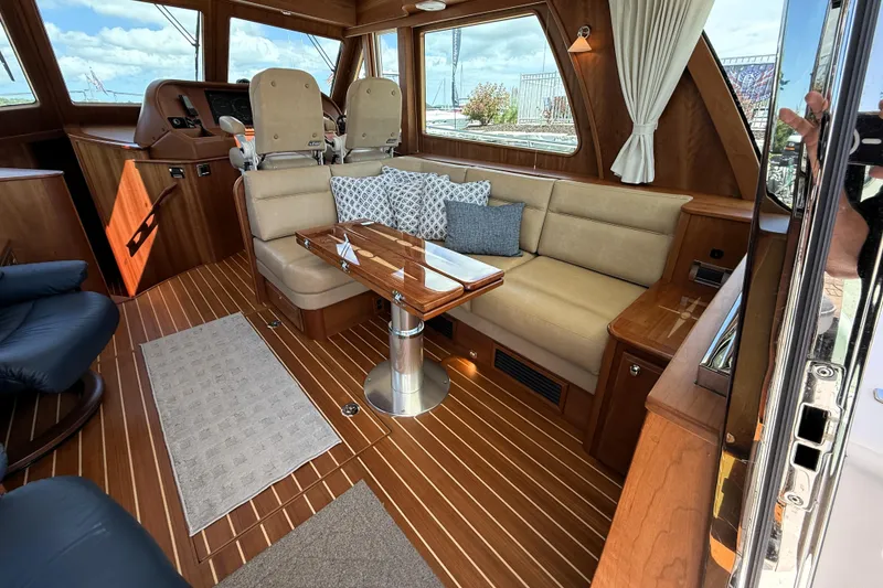 Slide: The Image of Luxurious interior of 2022 Sabre 48 Salon Express yacht with elegant seating and wooden finishes. - 15