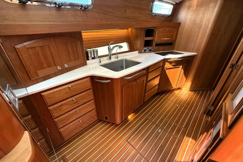 Slide: The Image of Luxurious wooden interior of 2022 Sabre 48 Salon Express yacht kitchen. - 28