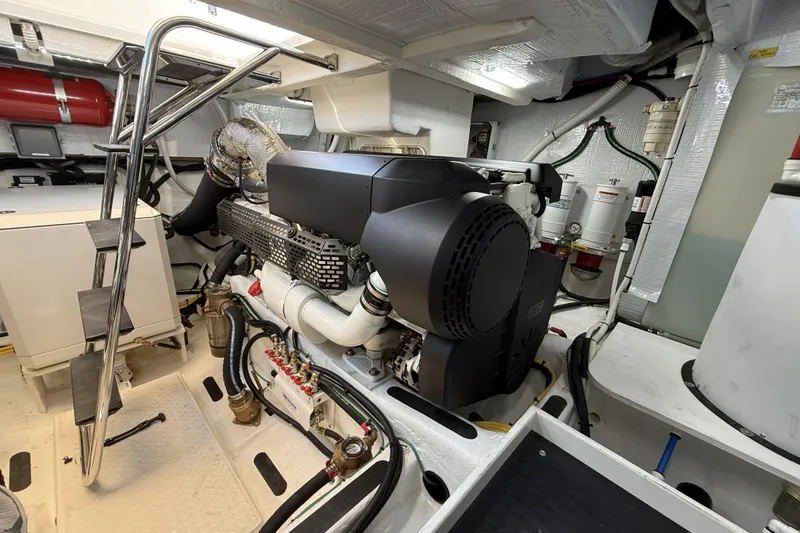 Slide: The Image of Engine room of 2022 Sabre 48 Salon Express yacht, featuring modern equipment and sleek design. - 54